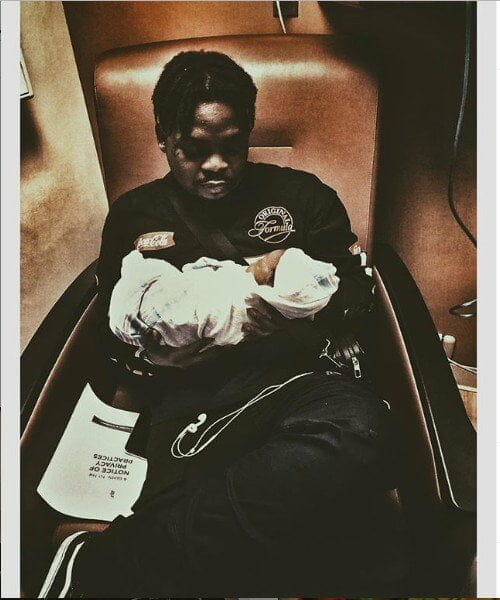 Olamide shares first photo with his newborn son, Tunrepin Myles Adedeji